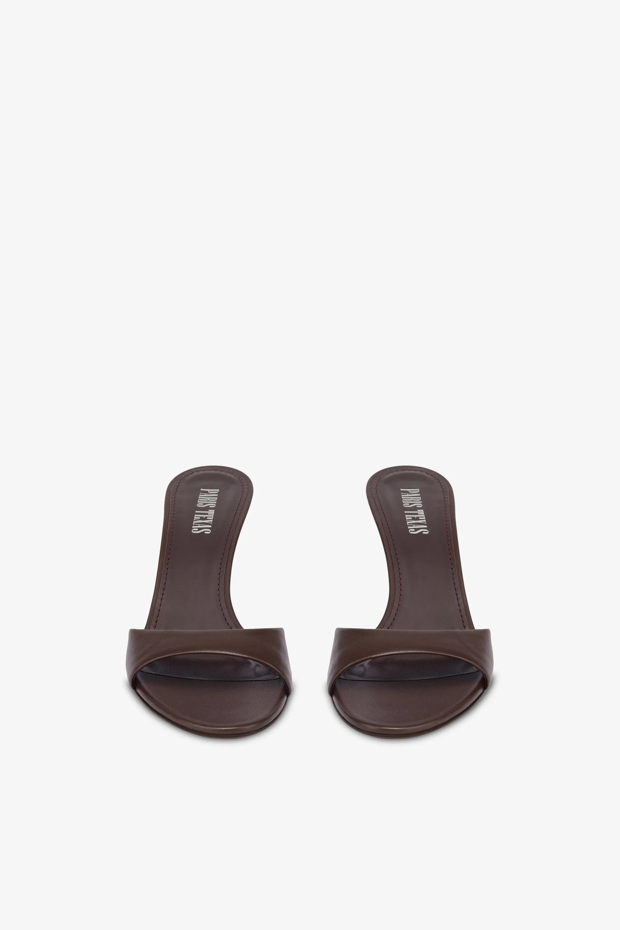Mules in ebony leather