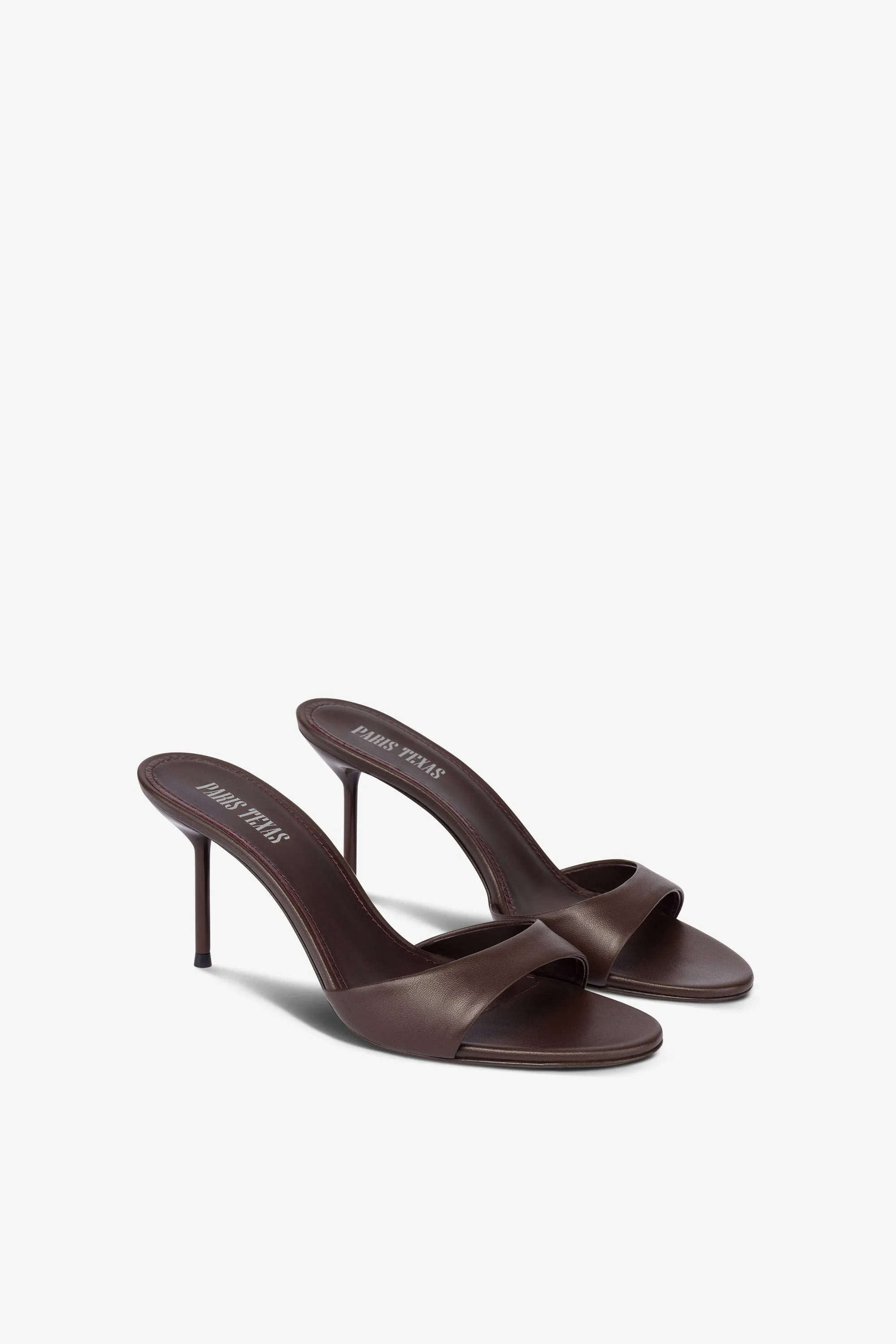 Mules in ebony leather